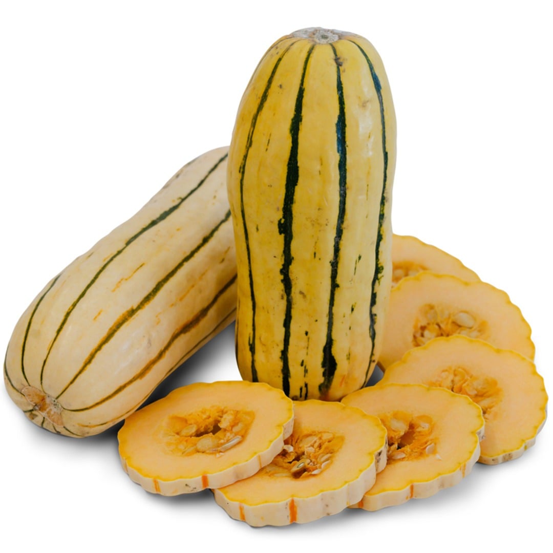 Whole and sliced Delicata Winter Squash on a white background.