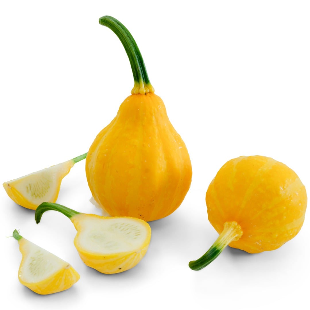 Whole and cut Lemon Summer Squash on a white background.