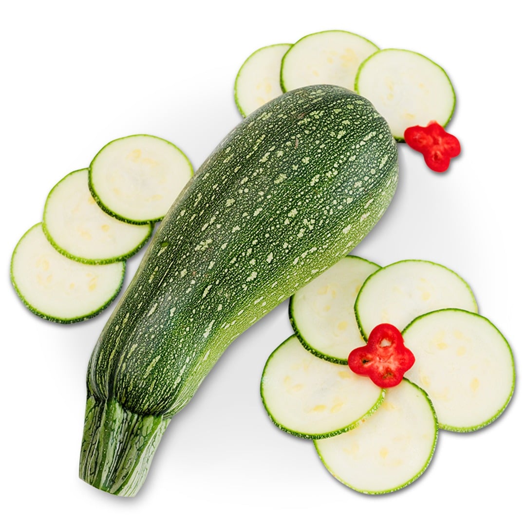 A whole zucchini gray with slices surround on a white background