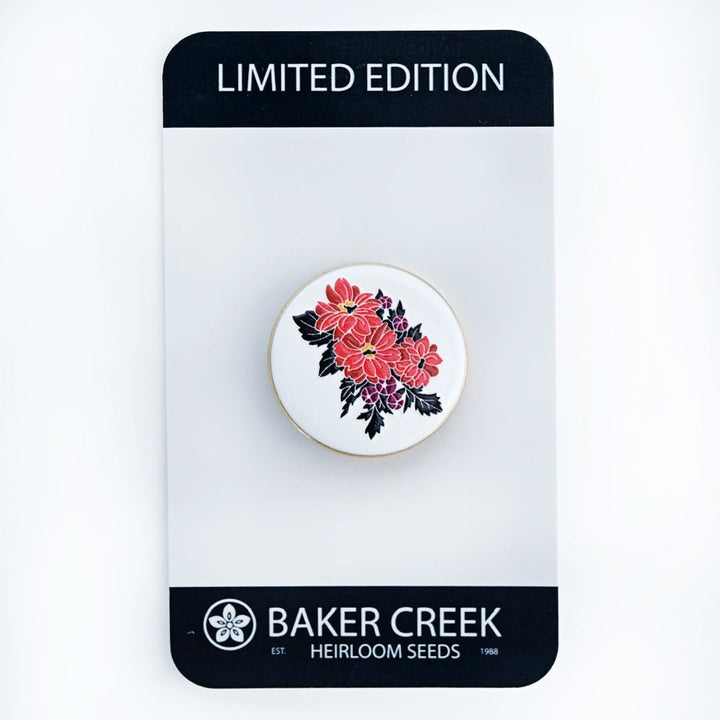 A Black Forest Ruby Dahlia Limited Edition Pin on a display card as it ships on a white background.
