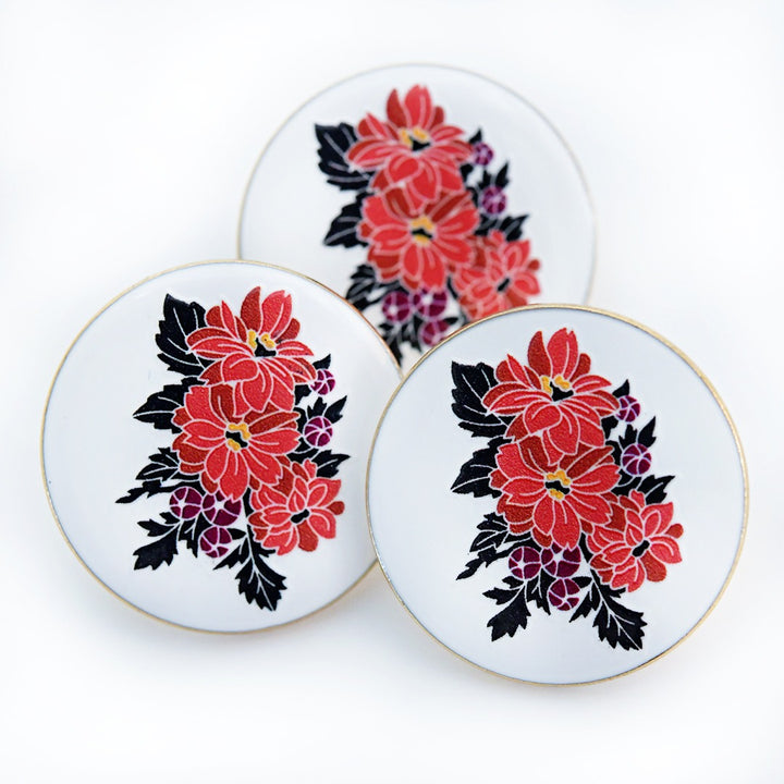 A trio of Black Forest Ruby Dahlia Limited Edition Pins on a white background.