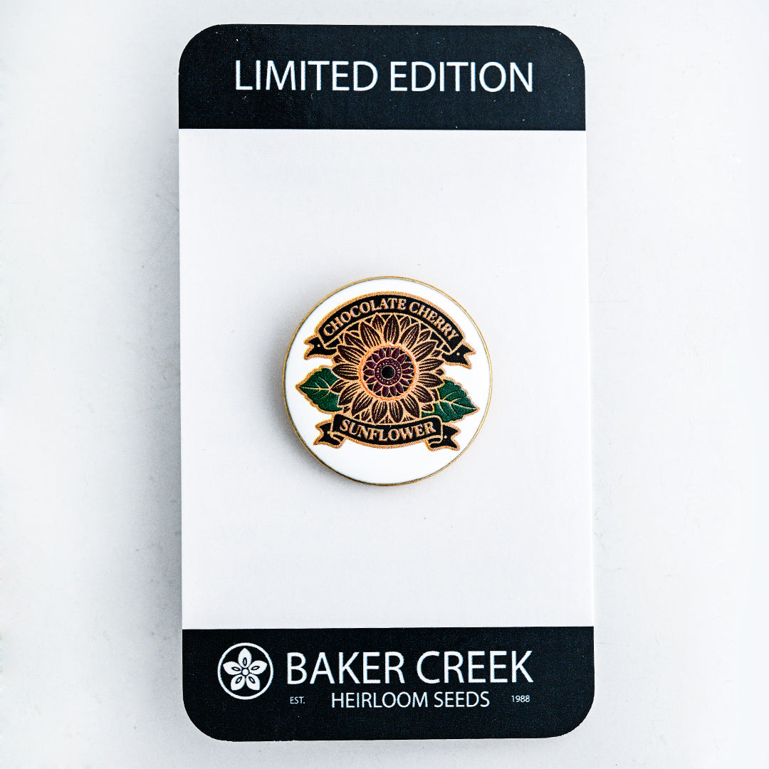 Chocolate Cherry Sunflower Limited Edition Pin shown on the front side of the packaging on a white background.
