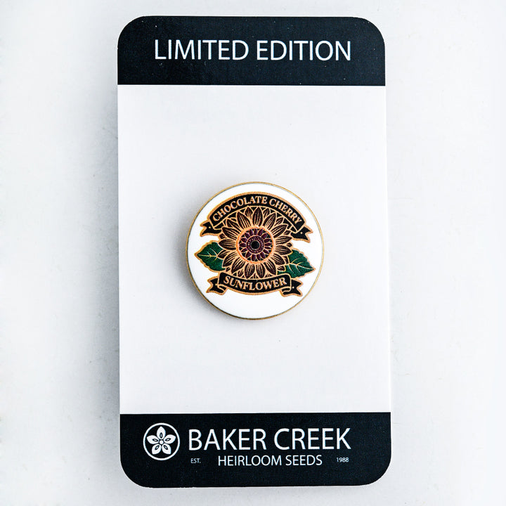 Chocolate Cherry Sunflower Limited Edition Pin shown on the front side of the packaging on a white background.