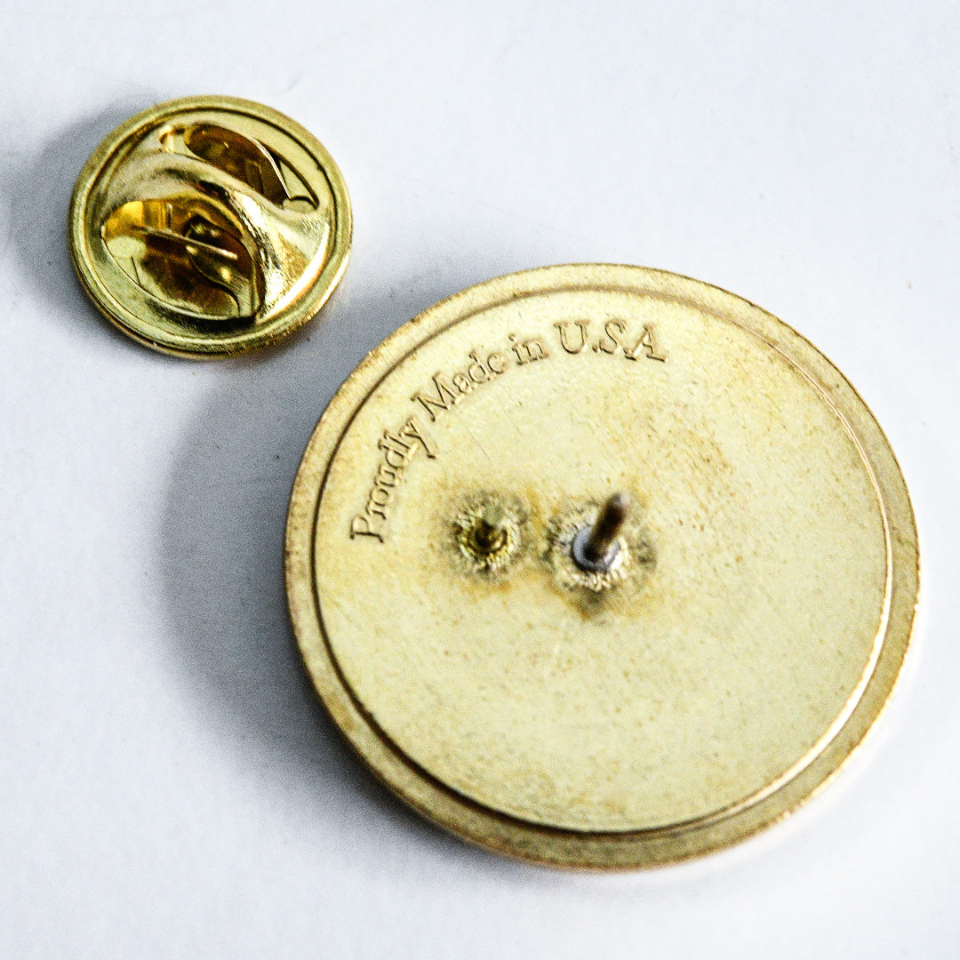 The backside of the Chocolate Cherry Sunflower Limited Edition Pin is shown on a white background.