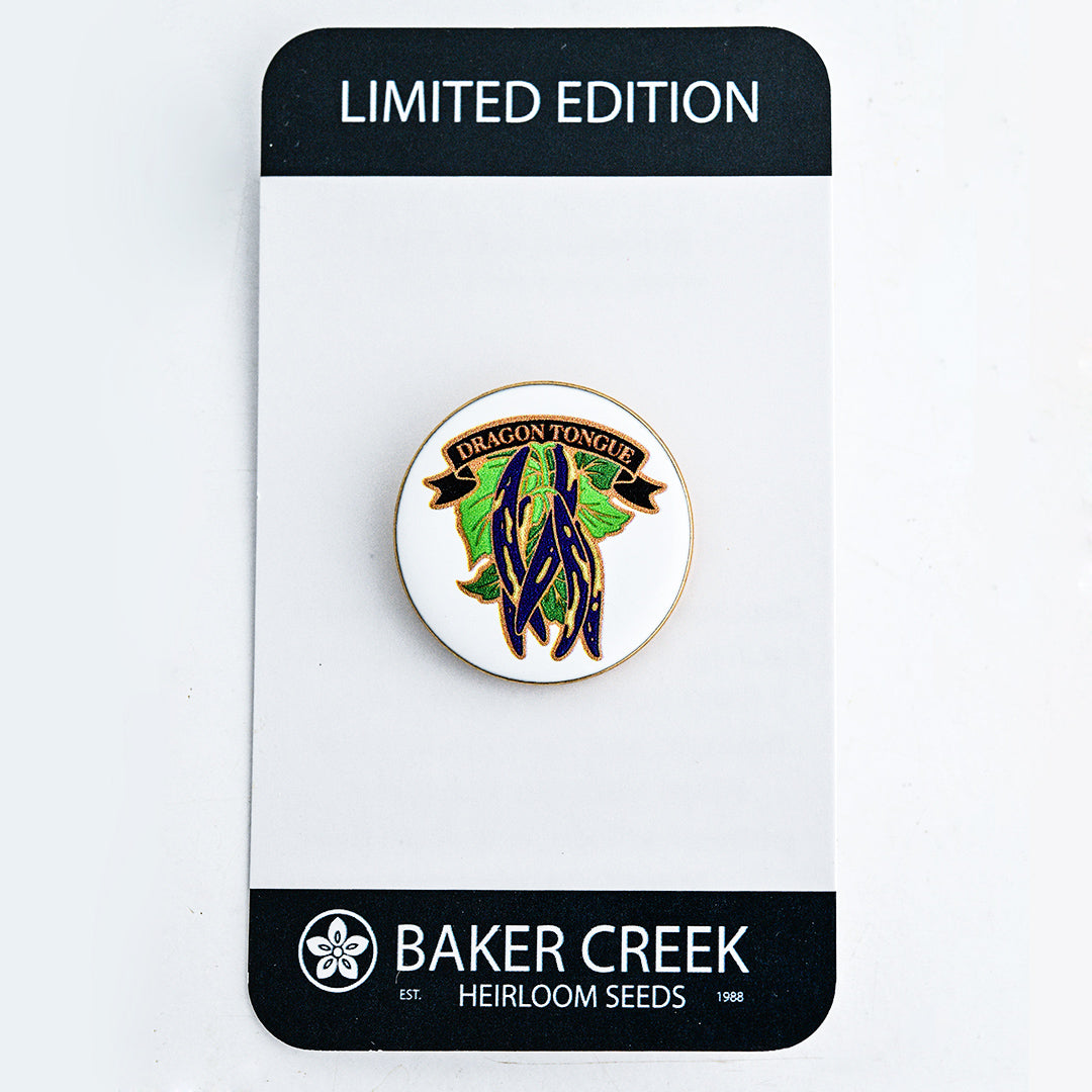 A Limited Edition Dragon Tongue Bean Pin shown with packaging on a white background.