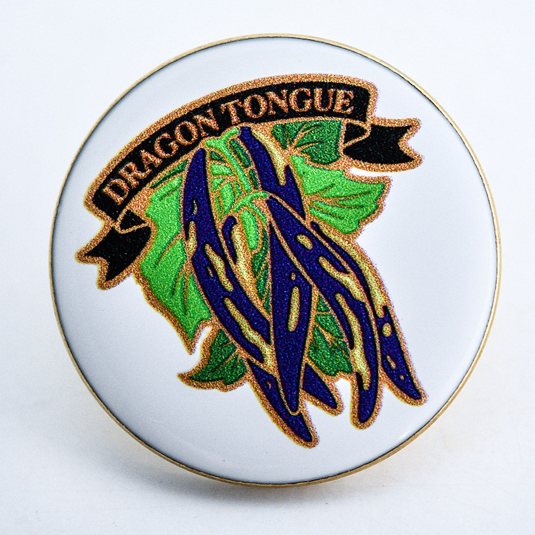 An extreme macro view of a Limited Edition Dragon Tongue Bean Pin.