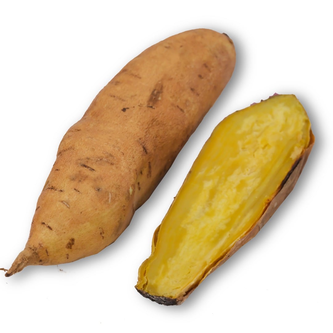 Cooked and whole raw Jersey Yellow Sweet Potatoes on white.