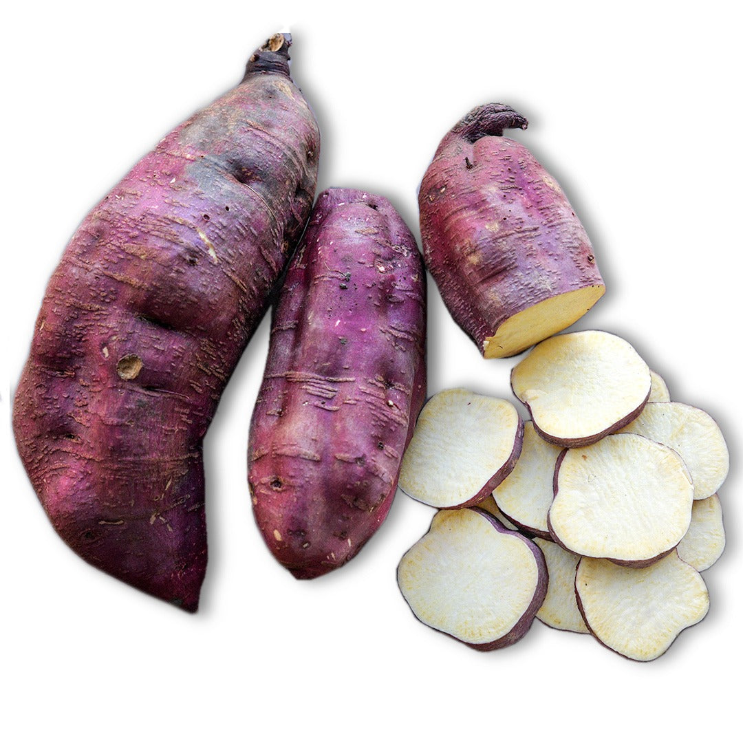 Cut and whole Myanmar Purple Sweet Potatoes on a white background.