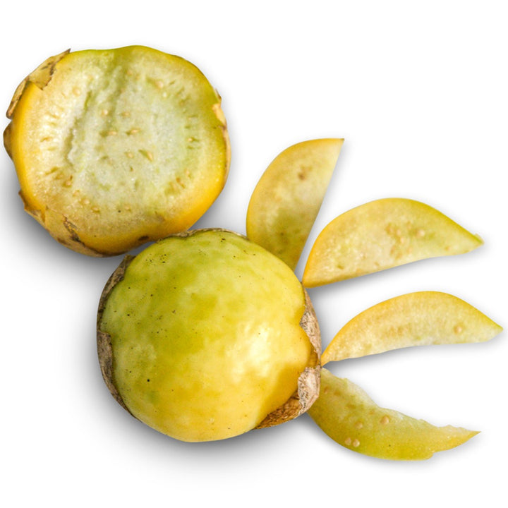 Whole and sliced Amarylla Tomatillos on a white background.