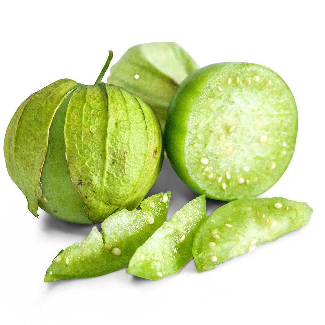 Whole and cut Rio Grande Verde tomatillos on a white background.