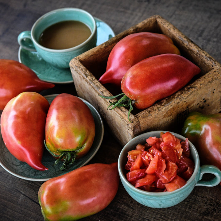 Korean Long Tomatoes on Korean dishes on a wooden background.