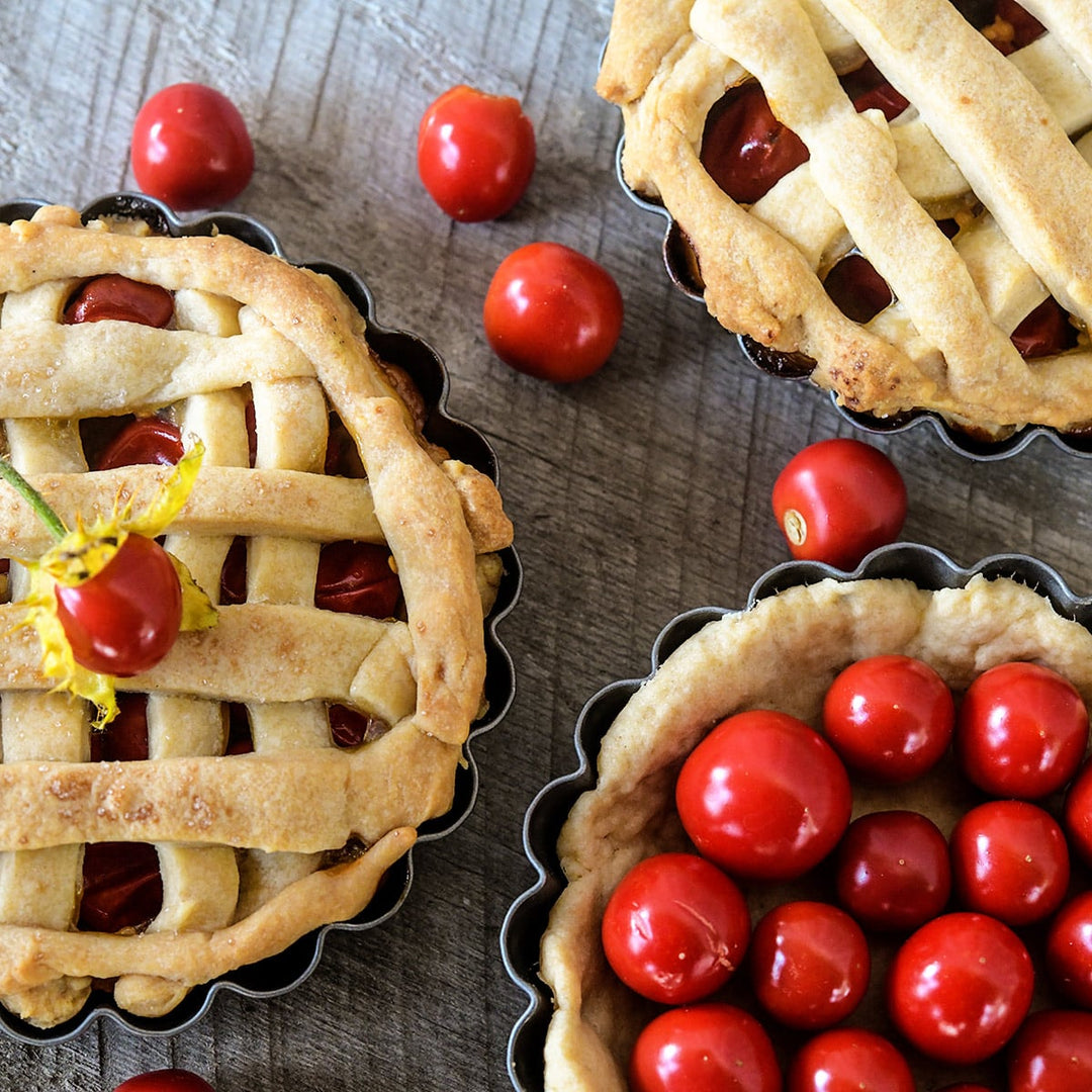 A trio of pies made from Litchi Tomato or Morelle De Balbis on a wooden background.