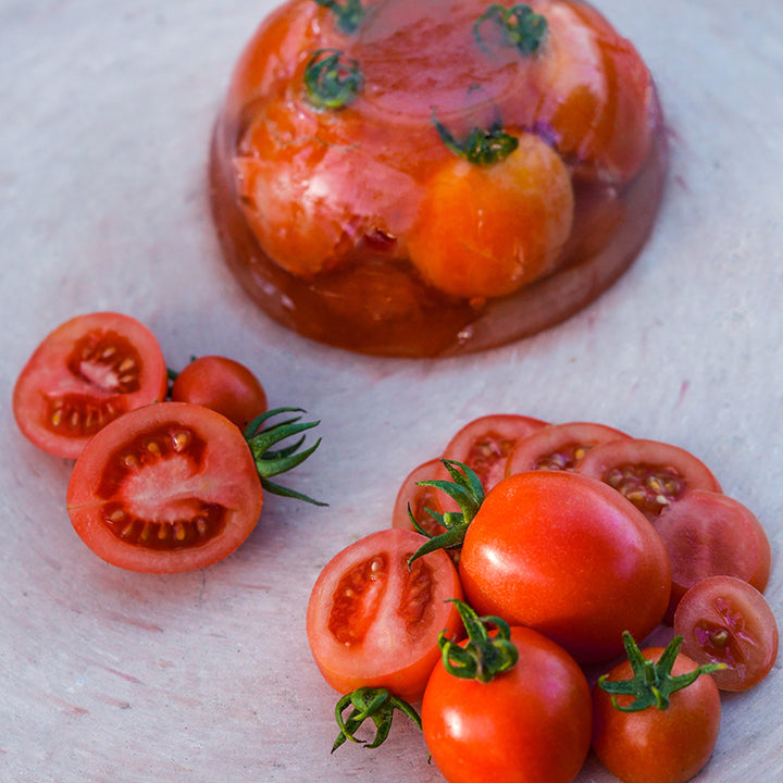 Principe Borghese Tomatoes with jello mold on an Italian ceramic pizza stone.