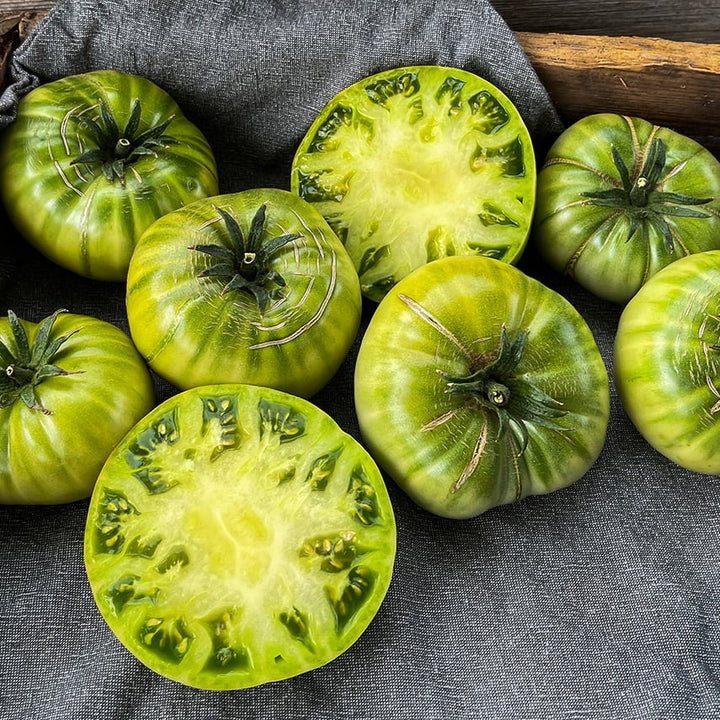 Green Giant tomatoes in box with a dishcloth. Image by Lucy Hutchins.