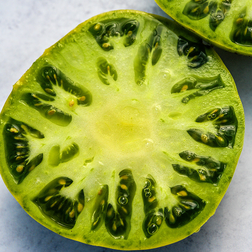 Close-up macro view of juicy slice of a Green Giant Tomato.