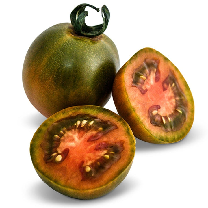 One whole and one sliced Evil Olive Tomato on a white background.