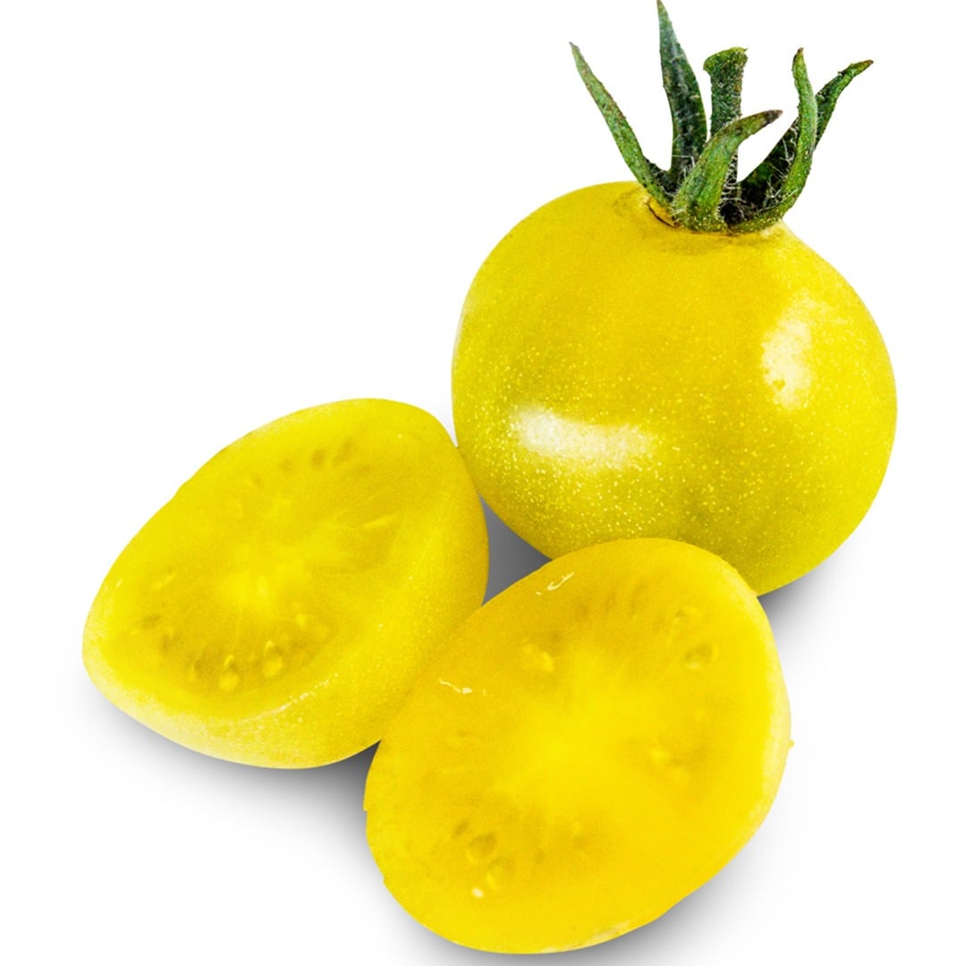Whole and cut Napa Chardonnay Tomatoes on a white background.