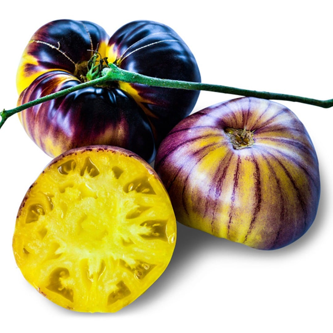 Pair of Sart Roloise tomatoes with a third cut in half to show the center.