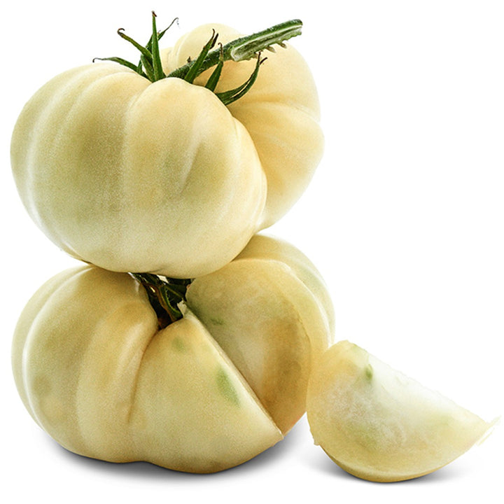 Two stacked White Beauty Tomatoes on a white background.