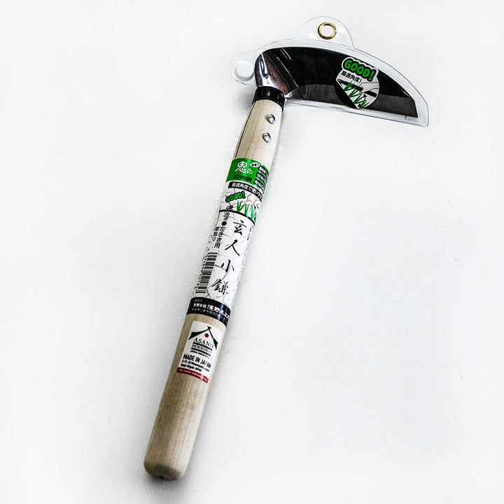 A Left Handed Professional Sickle with its packaging intact on a light background.
