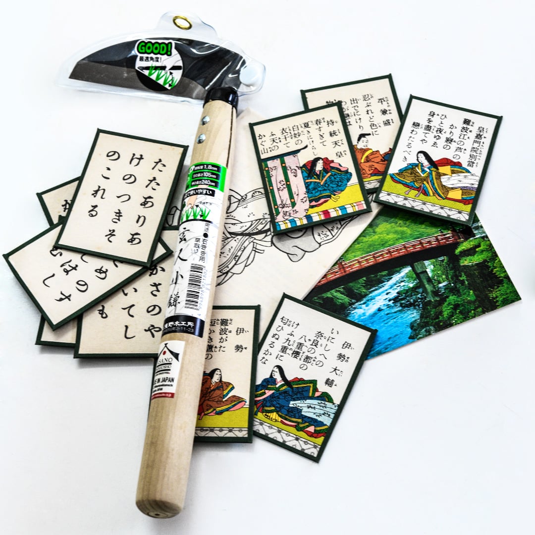 Professional Sickle Right Handed Tool in its packaging with Japanese cards and a postcard on white.