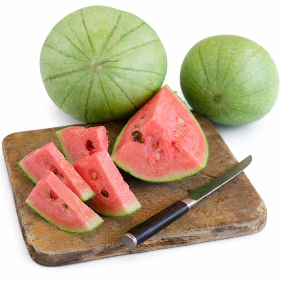Early Girl (Otome) watermelon with slices on a cutting board.