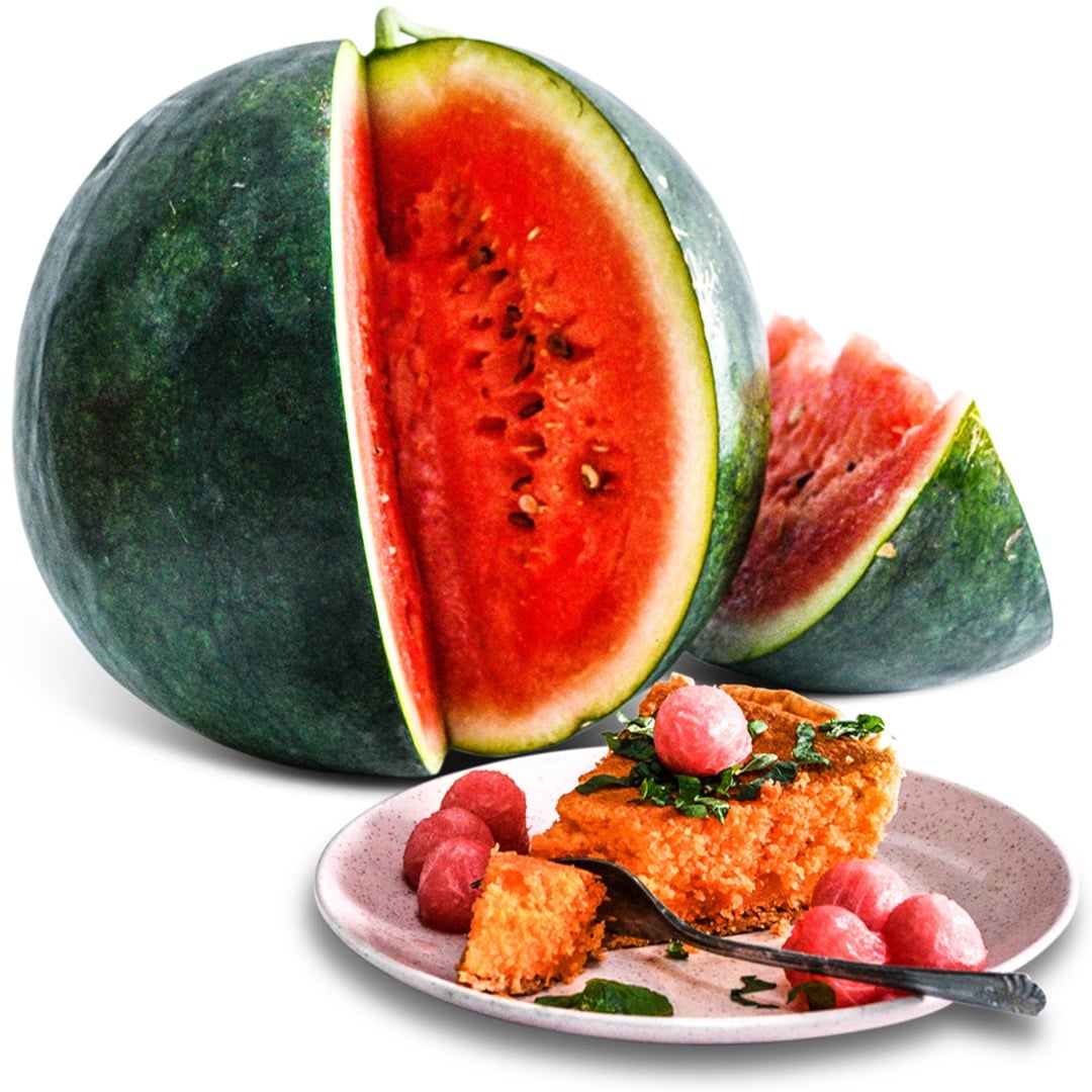 Single Sugar Baby Watermelon with plate of pie and watermelon balls on a white background.