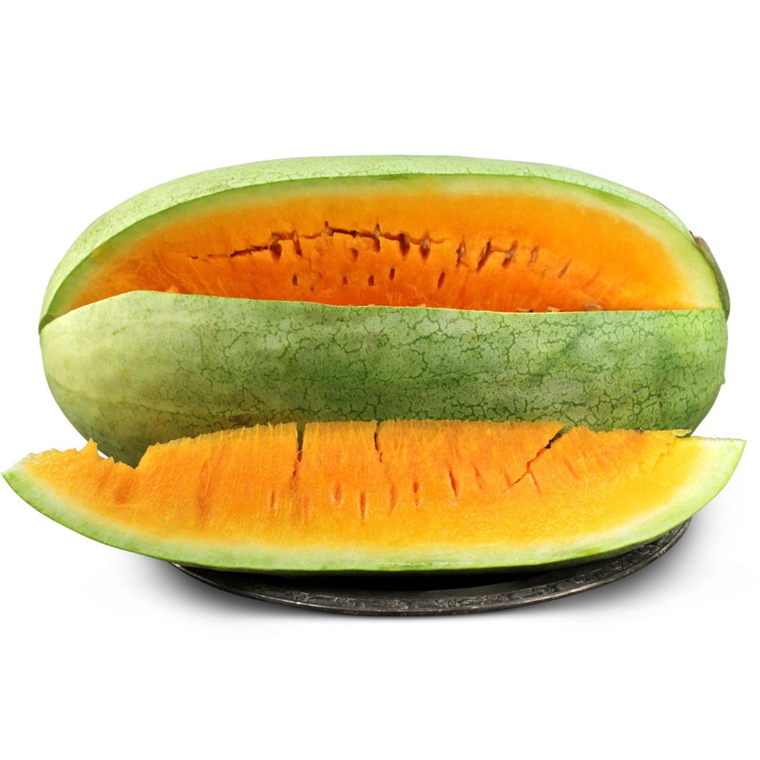 Single Texas Golden Watermelon on a silver tray with a white background.