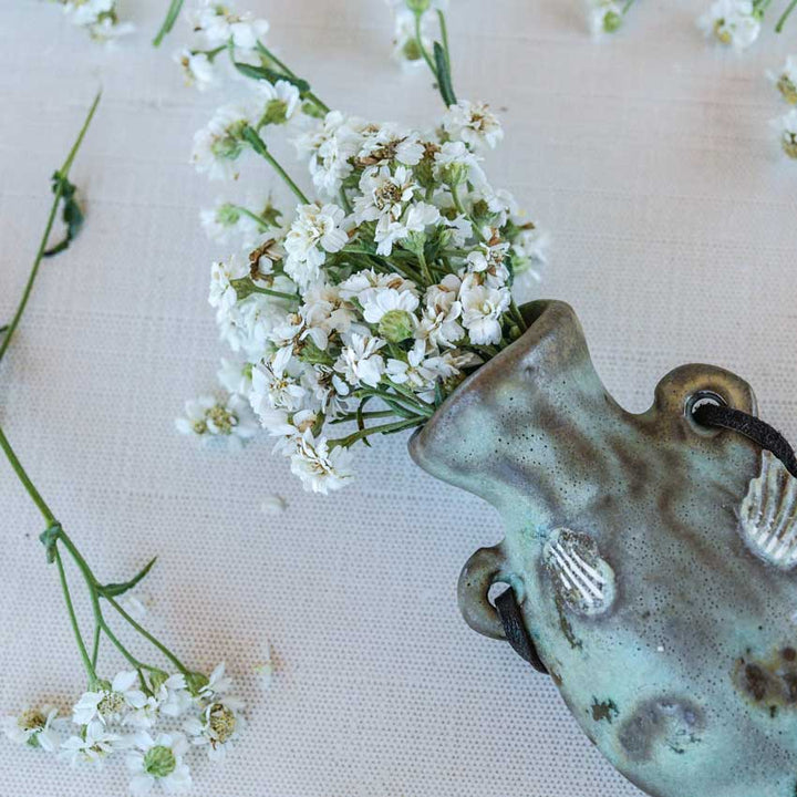 Double Diamond Pearl Yarrow bundle on fabric background.