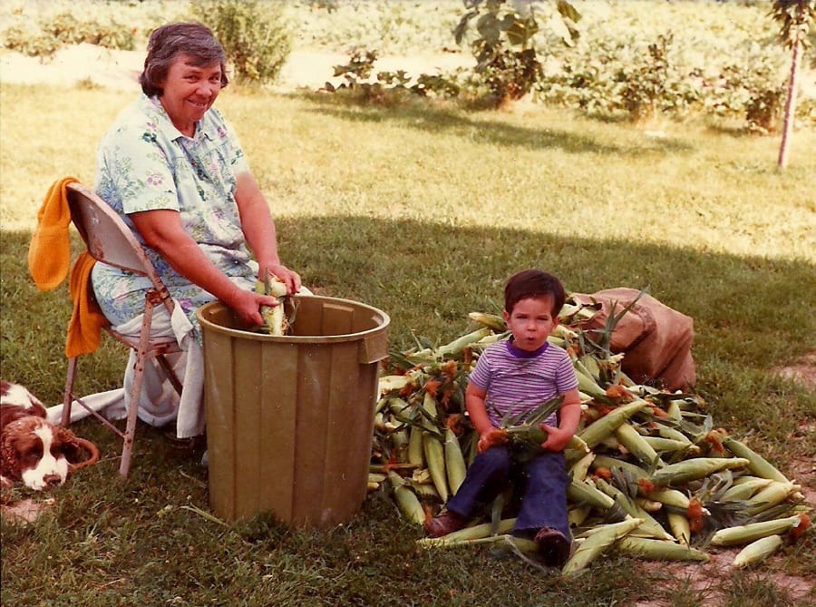 Jere Gettle as a child gardening with his grandmother