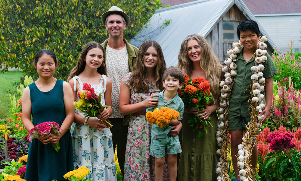 The Gettle family with flowers and garlic