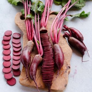 Sliced Cylindra Beets on cutting board.