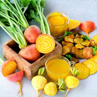 Cut and whole Golden Beets with beet chips and pickled and juiced beets.