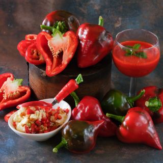 Lesya Sweer Pepper with pepper juice and salad on a rustic background. 