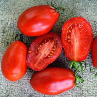 Martino's Roma Tomatoes on weathered wooden background.