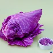 Kalibos Cabbage head and shreds on green background