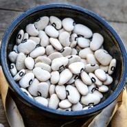 A bowl of Alabama Blackeyed Butterbean Lima Beans in a ceramic bowl.