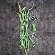 Thai Soldier Long Beans with cut and dried beans on a wooden background.