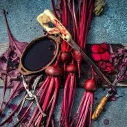 Bull's Blood Beets with juice, sliced and chopped beets and saw with beet juice all over it.