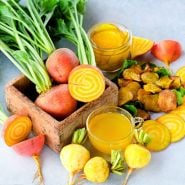 Cut and whole Golden Beets with beet chips and pickled and juiced beets.