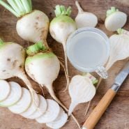 Albino Beets with beet juice on wooden countertop