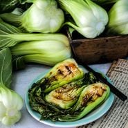 Shanghai Green Bok Choy recipe with fresh bok choy and a Chinese newspaper.