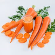 St. Valery Carrots with juice and slices on a white background.