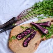 Pusa Asita Carrot slices on wooden plank.