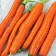 St. Valery Carrots freshly cleaned on marble slab.