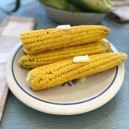 Golden Bantam Corn on plate with melting butter.