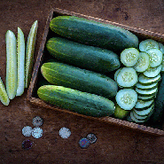 Ancash Cucumber, whole, sliced and speared in crate on wooden background