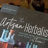 Detail of the cover of The Artisan Herbalist book by author Bevin Cohen.