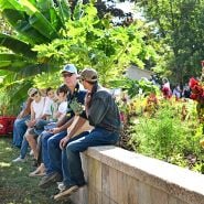 Folks hanging out in the gardens relaxing at the Baker Creek Fall Harvest Festival.
