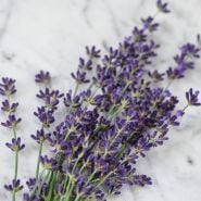 Lavender sprigs on marble countertop.